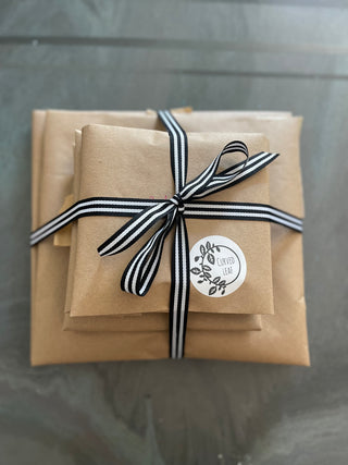 Sustainable and compostable packaging with reusable ribbon and sugar can shipping paper 