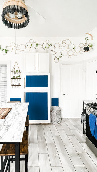 1990’s kitchen makeover into bright modern blue kitchen with trellis plants