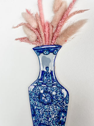 Blue and white floral-patterned vase with pink and blue feathers on a white background dried pink flowers ceramic vase on a white background curved leaf hand-drawn hand-painted print art prints affordable artwork artist made painted accents canvas paper blue & white ceramics chinoiserie vases ginger jar traditional decor Unframed Chinese pottery floral design trad grand millennial watercolor paper ready to frame elegance pink floral dried
