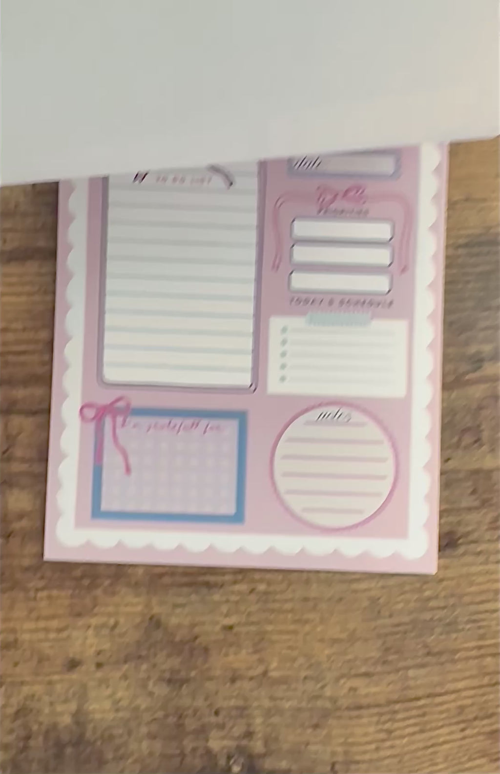 Daily planner with various sections on a pink background scalloped border cute pretty dopamine coquette cutesy day to-do list notebook adhd friendly checklist life hack kawaii small business bows mental health journal gratitude practice 